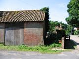 The old laundry building White House Farm beyond