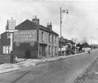 Blanch's Coal shop 1945 in front stands the sign for the Norfolk Arms PH 1945
