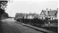 Tuck's postcard image.School Lane 1930s Showing both the Elementary School and the Headmasters house.
