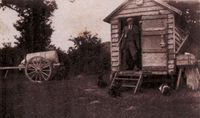 James Sturman on duty at the rearing fields, with the Feed preparation Hut. 1932