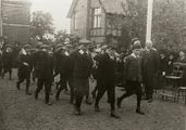 Photograph of the celebration of Empire Day at the Elementary School, School Lane. Headmasters house central background.